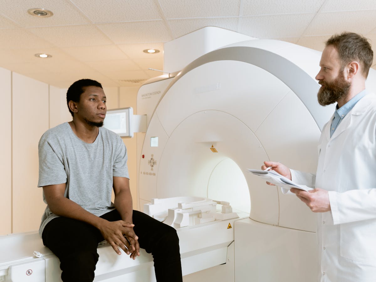 Clinician and patient at a modern diagnostic imaging facility